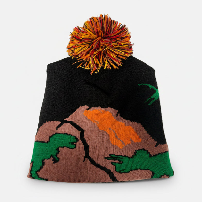 Knitted beanie with colorful pom-pom on a white background