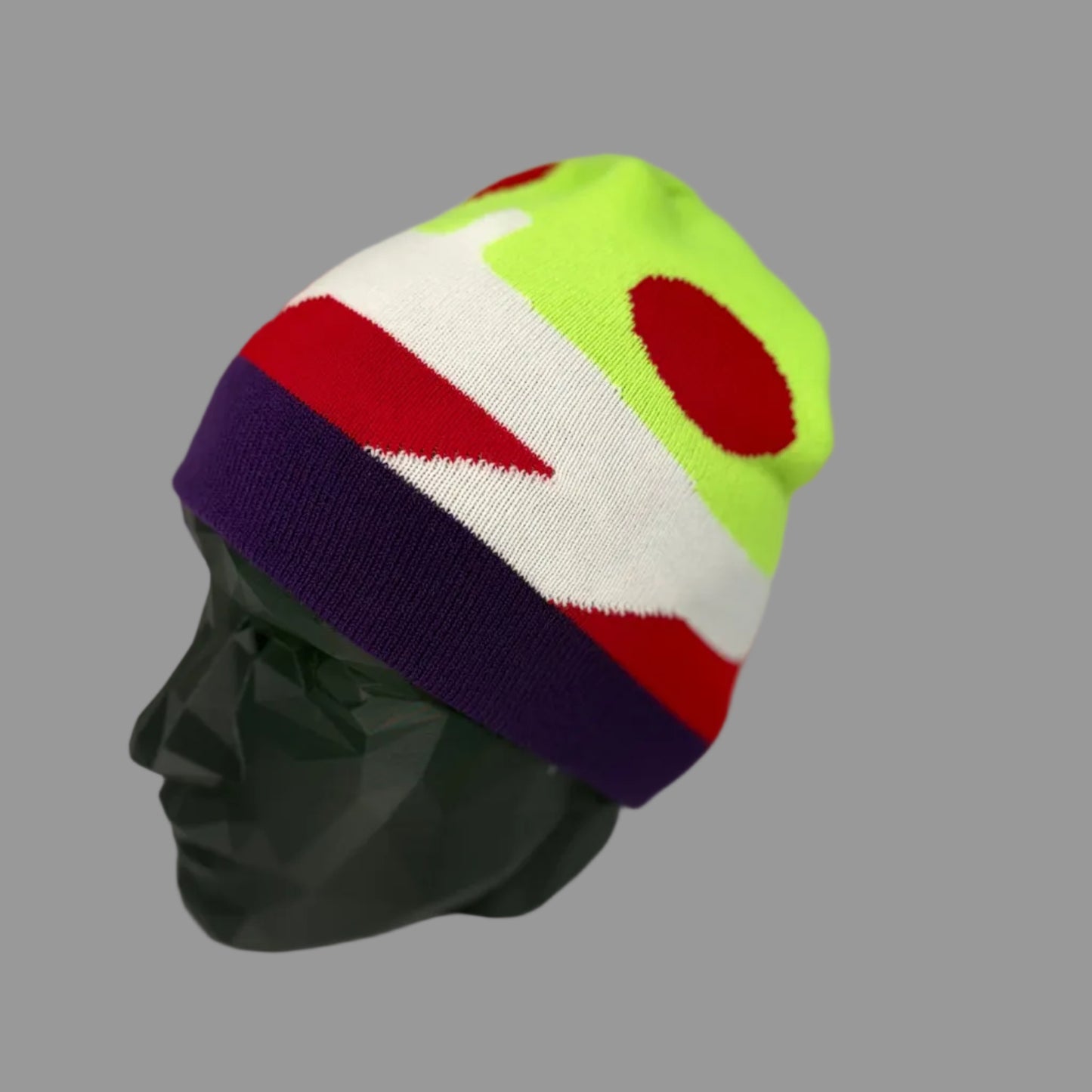 Colorful beanie on a mannequin head against a white background