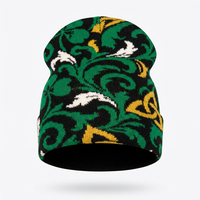 Green patterned beanie with white and gold accents on a white background