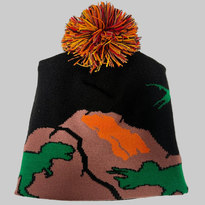 Knitted beanie with colorful pom-pom on a white background