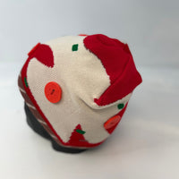 Pizza beanie with red and white pattern on a light gray background
