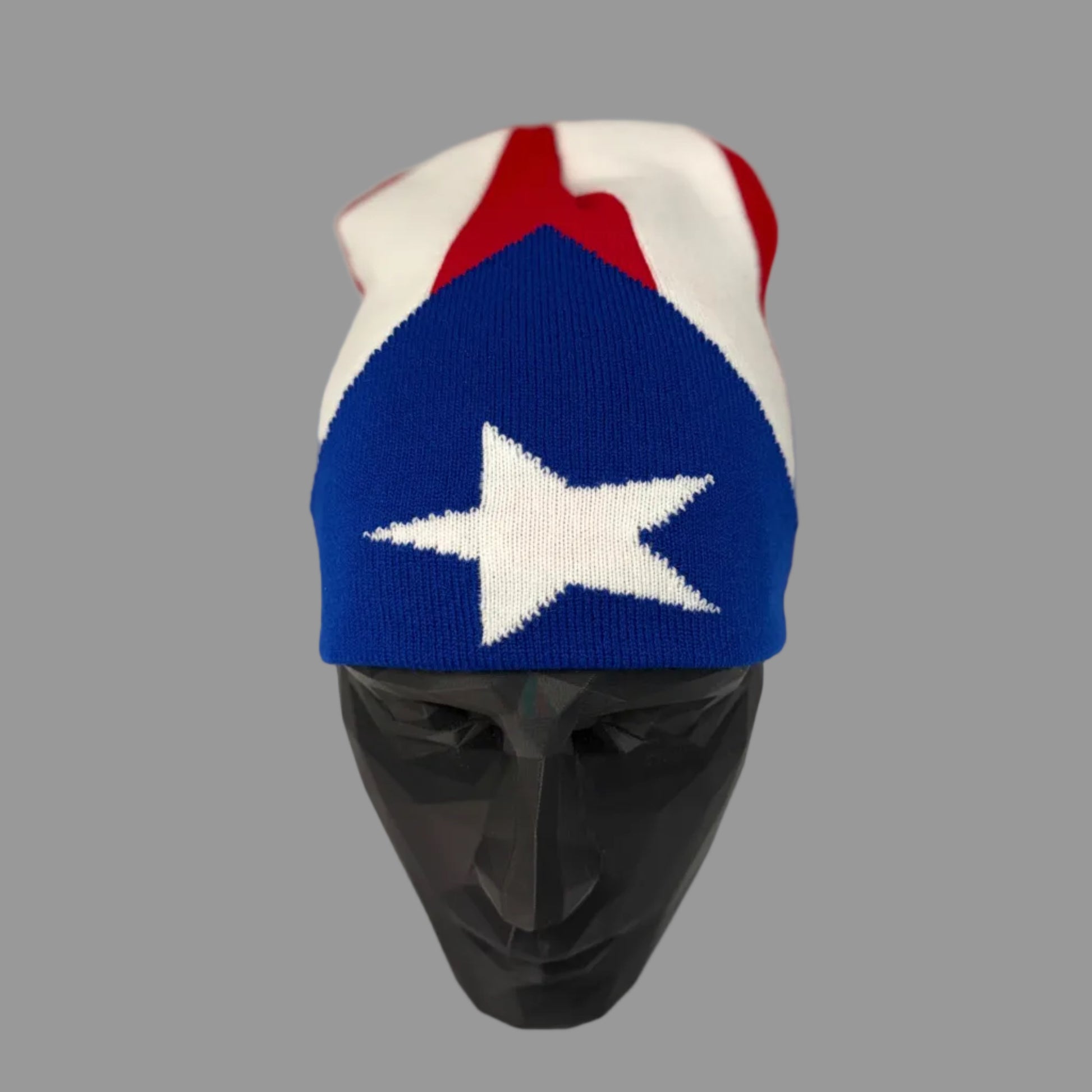 Knitted hat with American flag design on a mannequin head against a white background