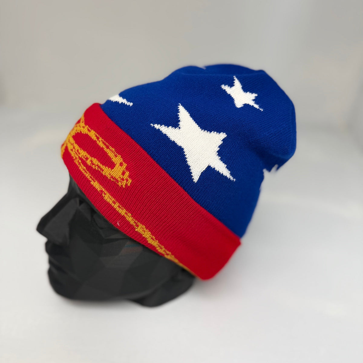 Colorful beanie with star design on a mannequin head against a white background