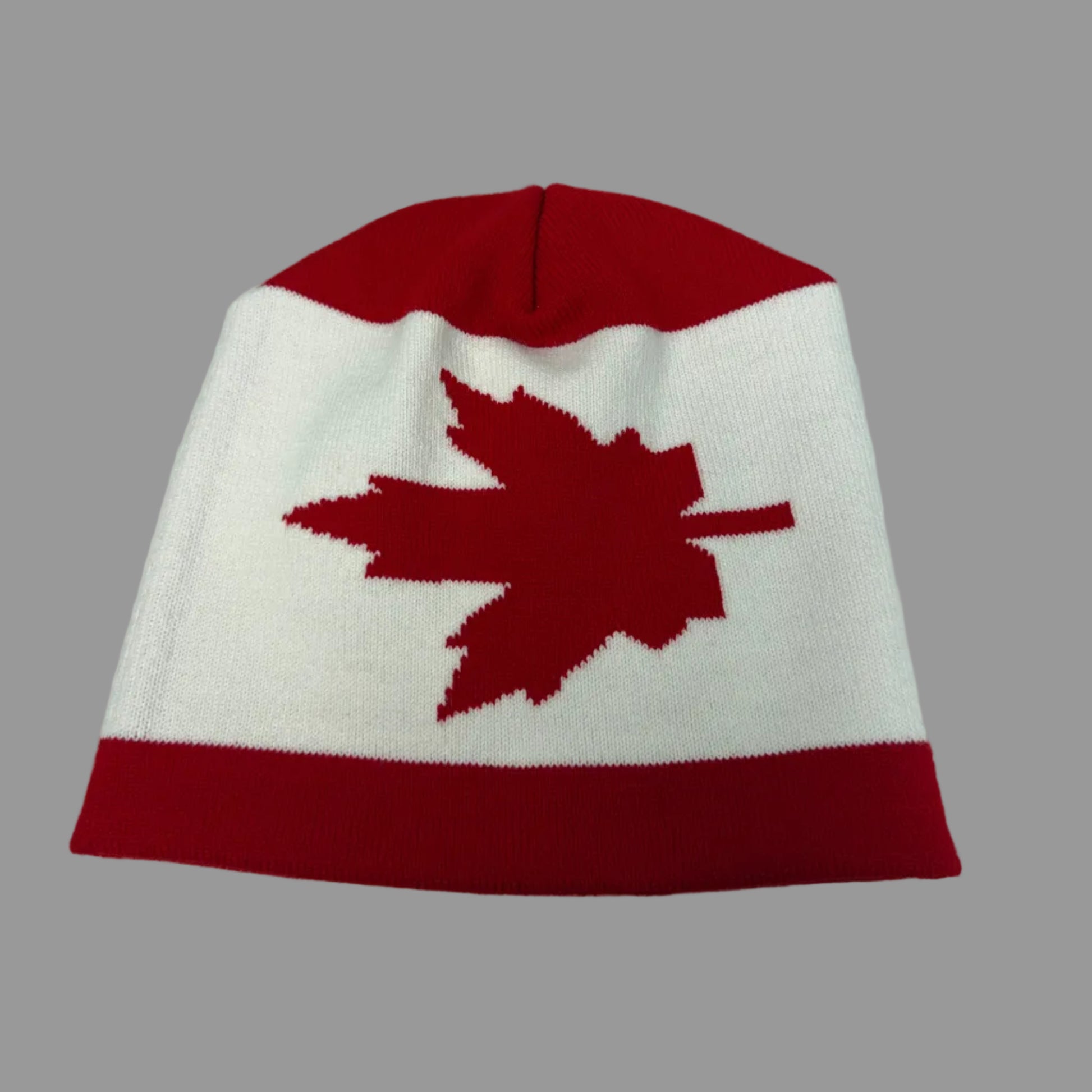 Beanie with a red maple leaf design on a white background