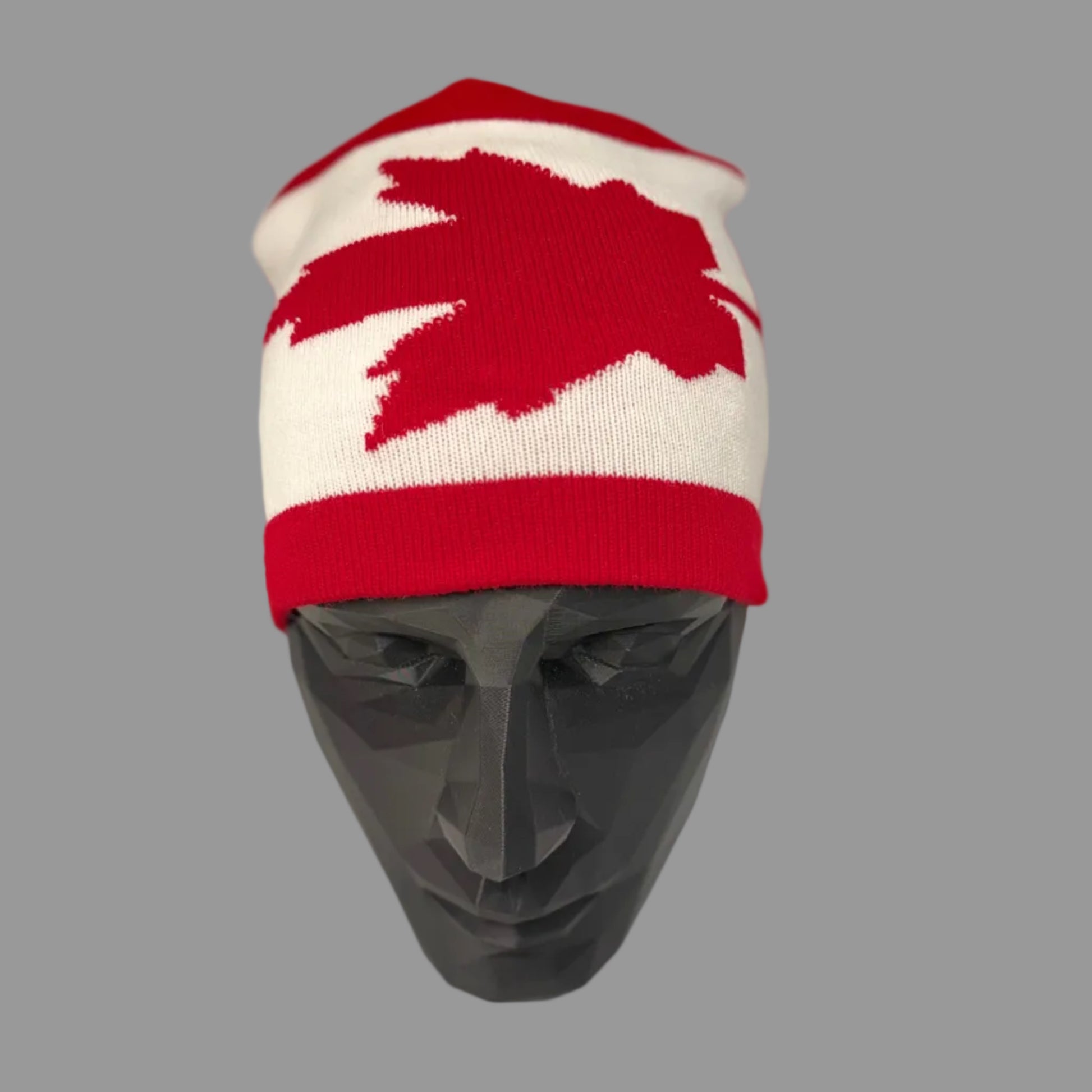 Red and white beanie with a bear design on a mannequin head against a white background