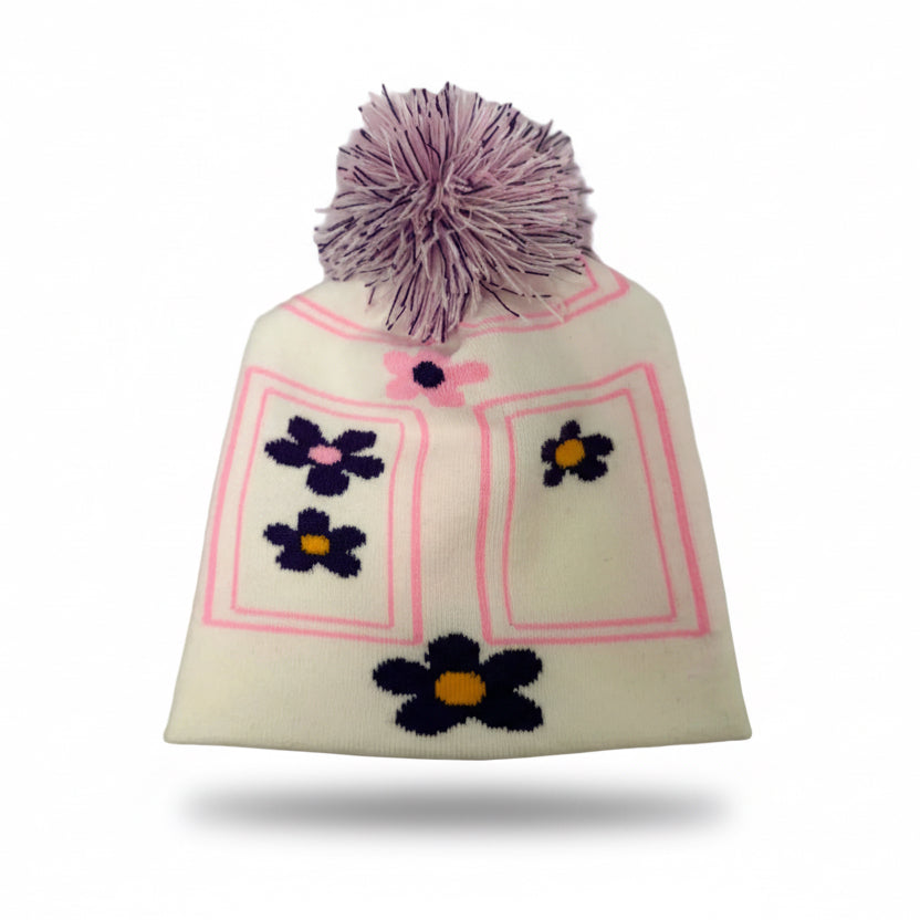 White knit beanie with purple flowers and a pink border on a white background