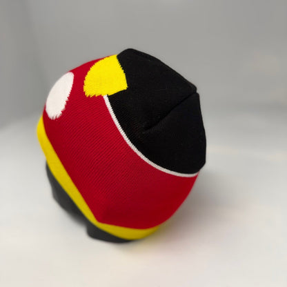 Colorful ball with black, yellow, and red sections on a white background