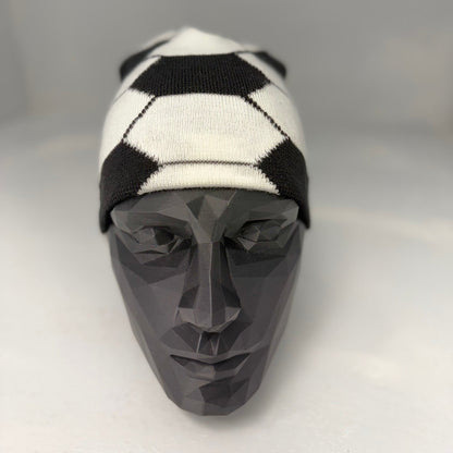 Black and white checkered beanie on a mannequin head against a gray background