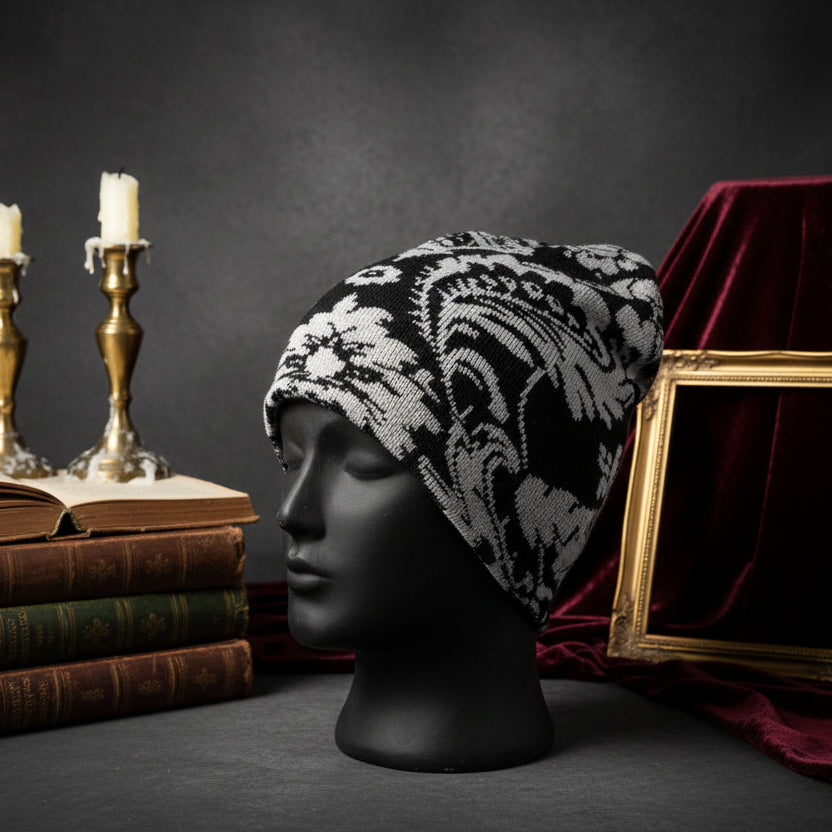 Black and white patterned beanie on a mannequin head against a white background