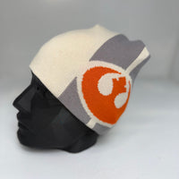 Knitted beanie with a logo on a mannequin head against a gray background