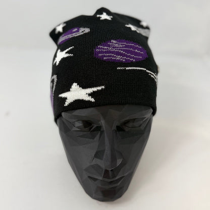 Black beanie with star and planet patterns on a mannequin head against a white background