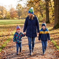 woman walking with 2 children all wearing beanies
