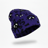 Purple beanie with black and white pattern on a white background