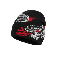 Black beanie with white and red dragon designs on a light gray background