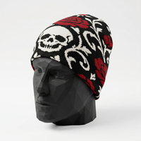 Skull and rose patterned beanie on a mannequin head against a white background