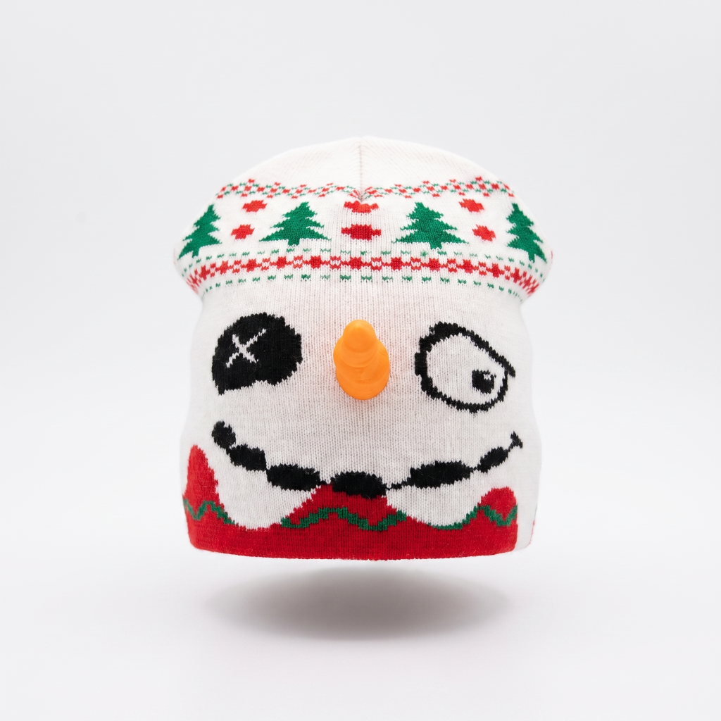 Knitted snowman hat with a white face, black eyes, orange nose, and red scarf on a white background.