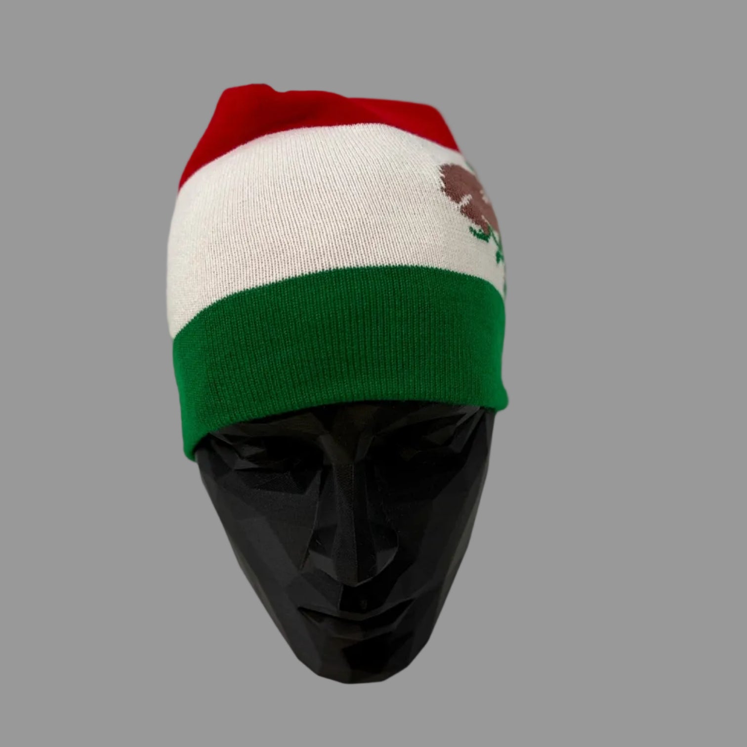 Colorful beanie with a logo on a mannequin head against a white background