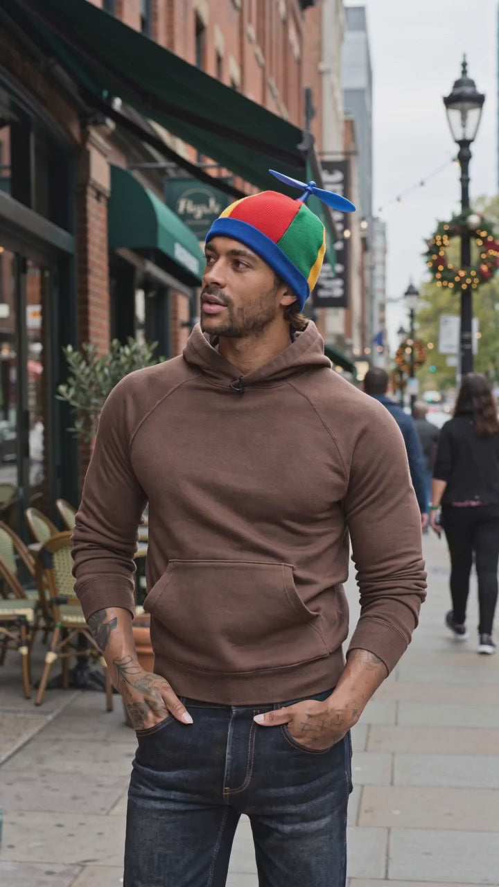 man being interviewed about pinwheel beanie