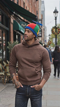 man being interviewed about pinwheel beanie