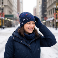 woman in snow wearing airline route beanie