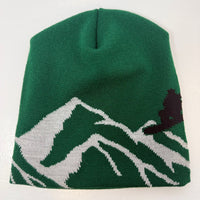 Green beanie with mountain and tree design on a white background